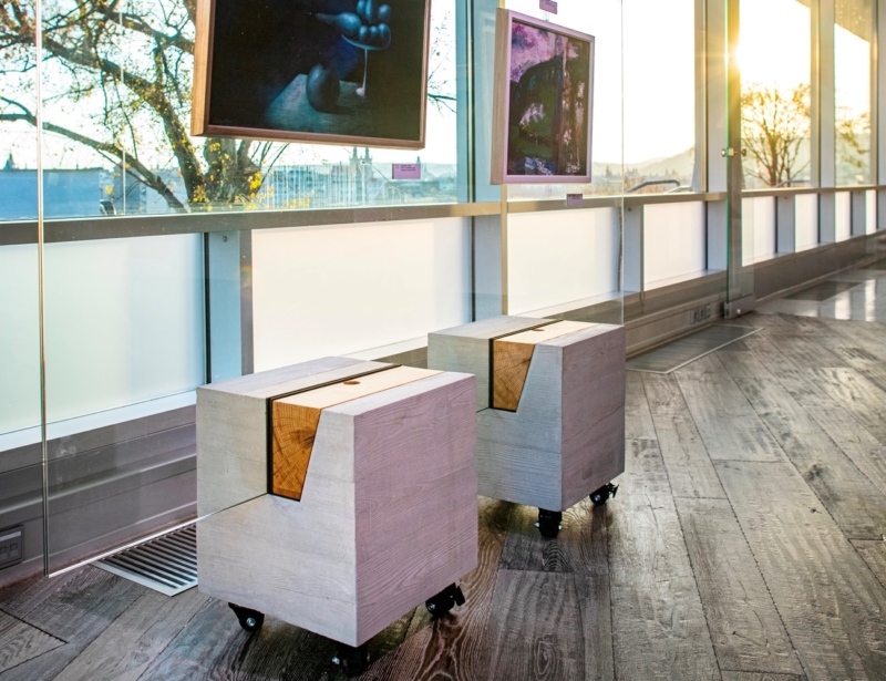 Concrete base and glass. Concrete stands for paintings