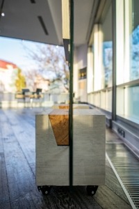 Concrete base and glass. Concrete stands for paintings