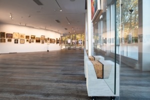 Concrete base and glass. Concrete stands for paintings