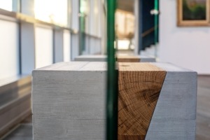 Concrete base and glass. Concrete stands for paintings